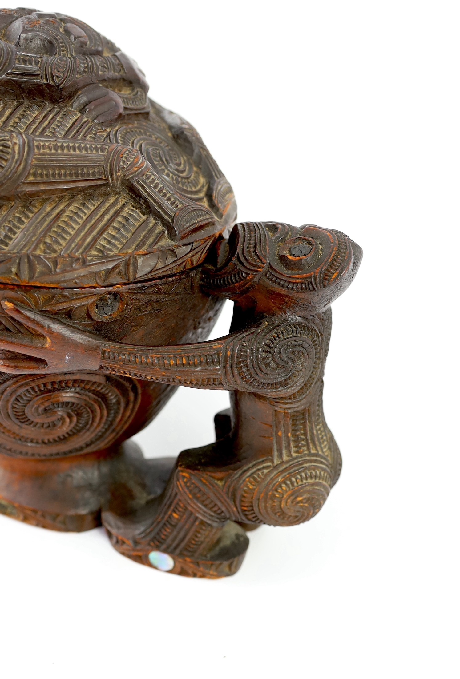 A Maori carved wood oblong bowl and cover, kumete, c.1880-1910, height 23cm length 31cm